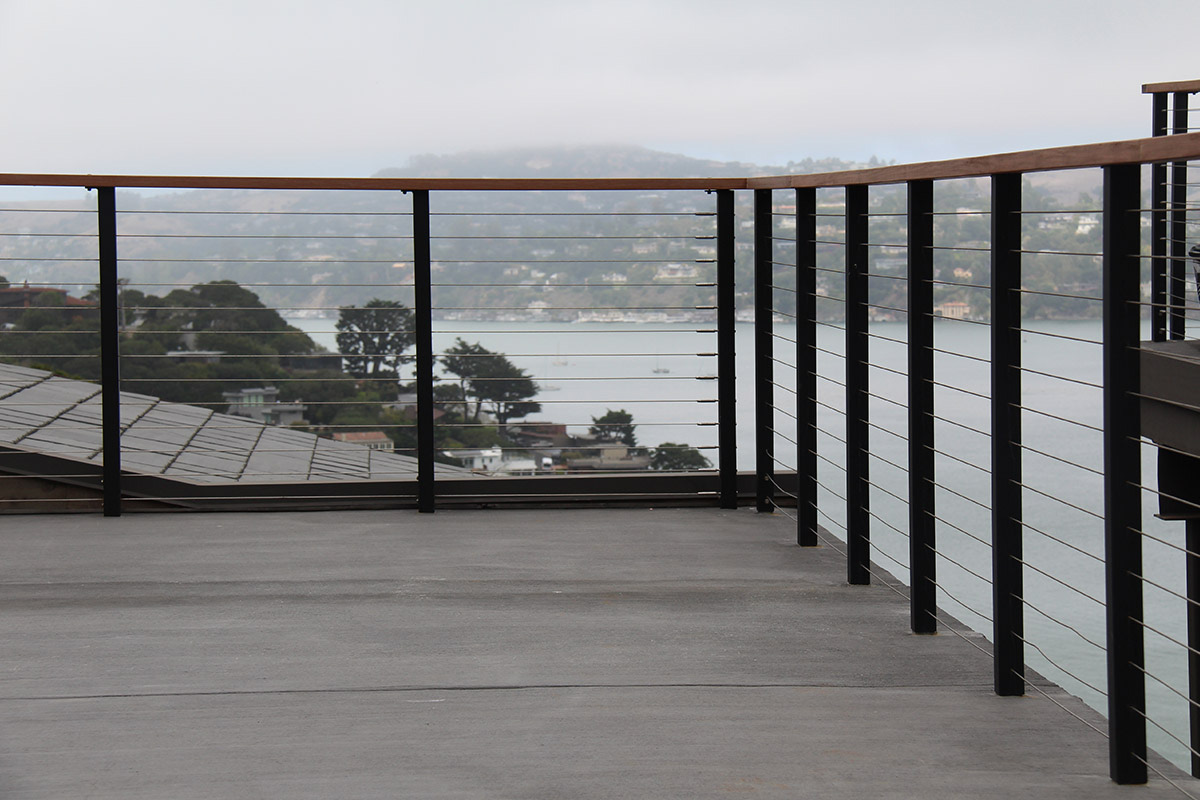 Matte black steel cable railing installation